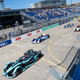 A photo of the cars on the starting grid for a Formula E race.